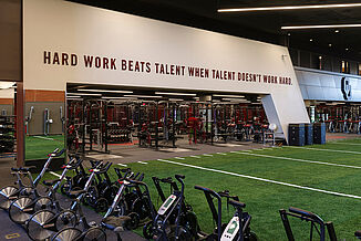 Oklahoma University Weight Training - REGUPOL aktivpro roll and Turf Area Training facility at Oklahoma University featuring the seamless transition of the turf area, into the REGUPOL aktivpro roll flooring located in the weight training area.