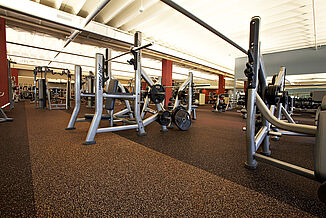 View of free weights and benches at Horsham Athletic Club all rest on REGUPOL aktiv flooring.