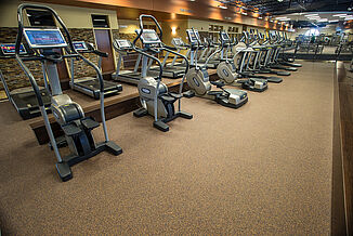 View of cardio equipment in Team 85 Fitness Center. The equipment sits on REGUPOL aktiv flooring, providing a smooth foundation. 