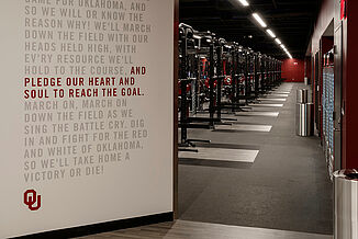 Oklahoma University Weight Training - View of Weight Room Doorway into the training facility at Oklahoma University. REGUPOL aktivpro roll flooring is used throughout the facility for durability.