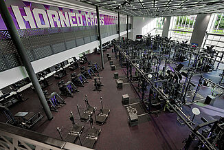 Downward view of facility featuring a variety of equipment TCU offers for athletes in the football performance center.