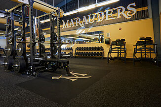 View of the weight rack in the Millersville University featuring REGUPOL aktivpro roll and crash flooring throughout the facility.