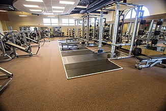 Platforms in the Team 85 facility allow for members to perform heavy lifting exercises in a highly durable space.