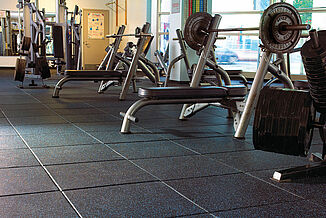 Two weight benches sit on Temple University's REGUPOL aktipro rubber flooring.