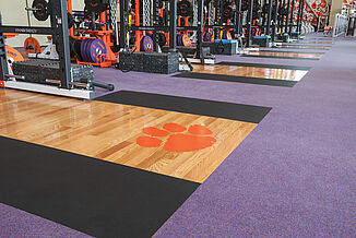 A close look at the Clemson lifting platforms inlaid seamlessly into the floor.