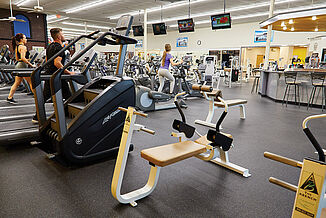 New York Fitness - Fitness Center with REGUPOL flooring View of the New York Fitness Club facility featuring cardio equipment and weight training options. All equipment throughout the facility rests on REGUPOL aktiv rolled rubber flooring.