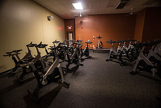 The spin room in Team 85 features a number of spin bikes, allowing members to workout cohesively in a class setting.