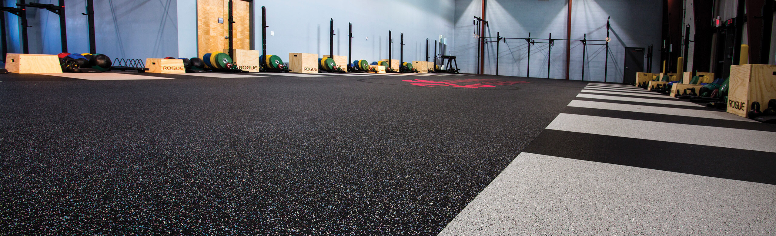 REGUPOL aktivplus High Performance 1/2-inch Sports Flooring Facility utilizing REGUPOL aktivplus High Performance Sports Flooring. The flooring choice demonstrates the ability for a seamless option, by even incorporating heavy lifting platform areas.