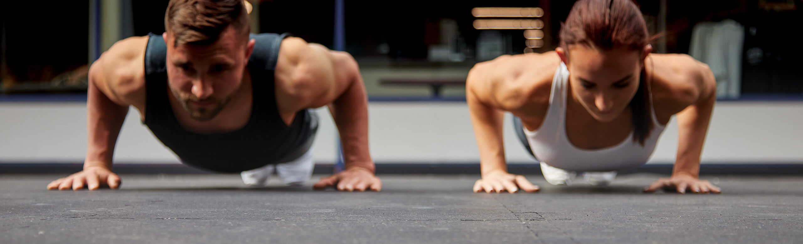 New York Fitness - Pushups on REGUPOL flooring Two athletes perform push-ups on the REGUPOL aktivlok flooring in the New York Fitness Club in Lebanon.